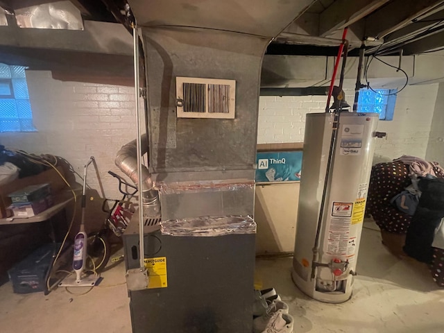 utility room with gas water heater