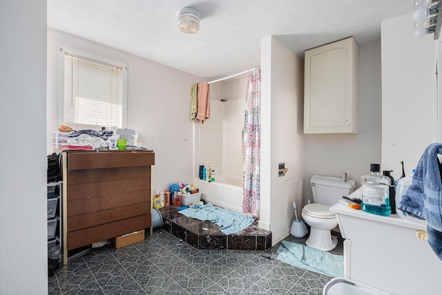 bathroom with toilet and shower / tub combo with curtain