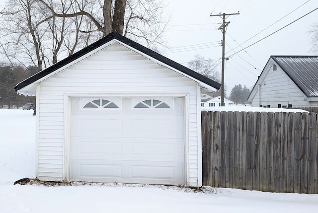 view of snow covered garage