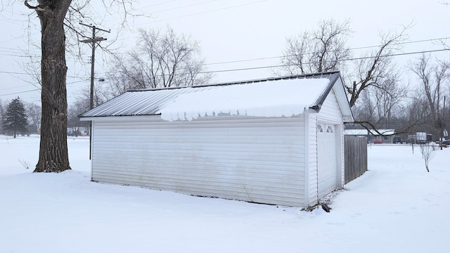 view of snow covered garage