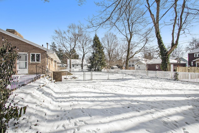 view of yard covered in snow