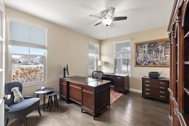 office area featuring dark wood-type flooring and ceiling fan