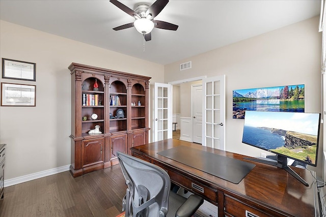 home office with dark hardwood / wood-style floors, ceiling fan, and french doors