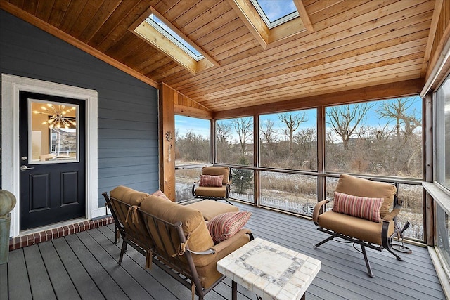 sunroom / solarium with wooden ceiling and vaulted ceiling with skylight