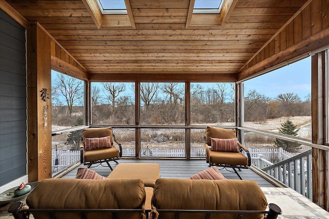 unfurnished sunroom with wood ceiling and lofted ceiling with skylight