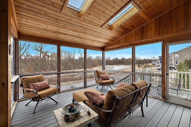 sunroom / solarium with vaulted ceiling with skylight and wooden ceiling