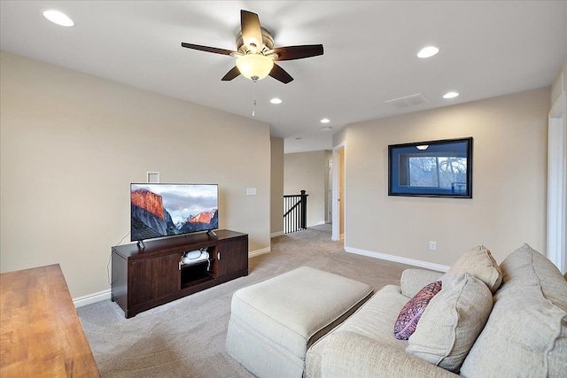 living room featuring ceiling fan and light carpet