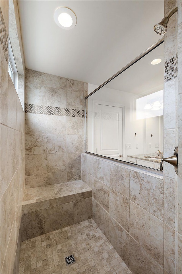 bathroom with tiled shower