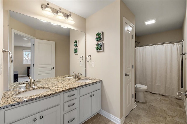 bathroom featuring vanity, toilet, and a shower with shower curtain