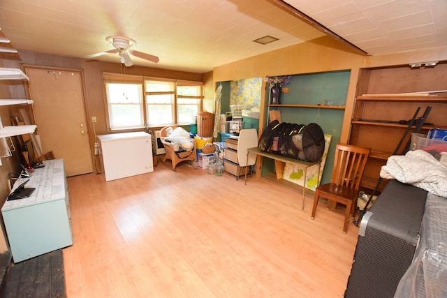 miscellaneous room with ceiling fan and wood-type flooring