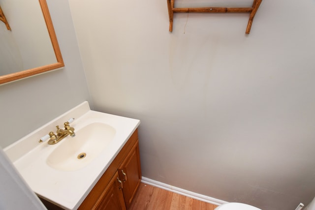 bathroom featuring hardwood / wood-style flooring and vanity