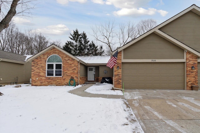 ranch-style house with a garage, concrete driveway, and brick siding