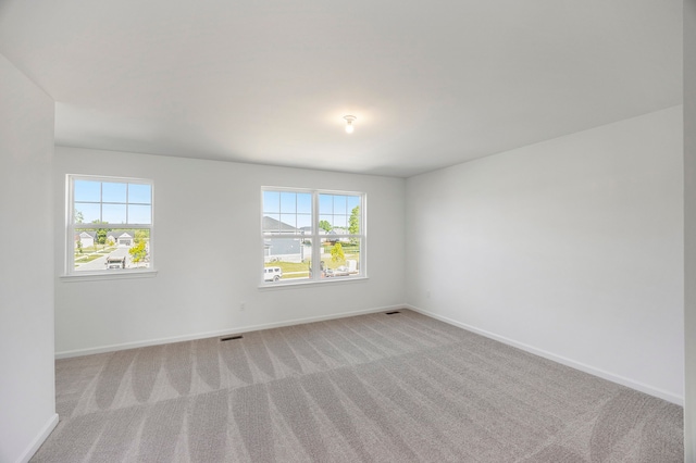 11964 Timber Ct, Bruce, MI 48065 - unfurnished room featuring plenty of natural light, baseboards, and visible vents