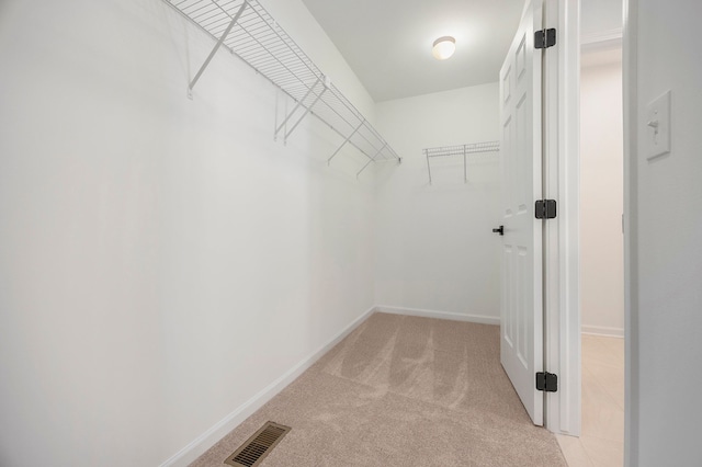 11964 Timber Ct, Bruce, MI 48065 - walk in closet featuring visible vents and light colored carpet