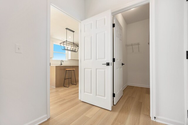 11964 Timber Ct, Bruce, MI 48065 - hallway featuring light wood-style floors and baseboards