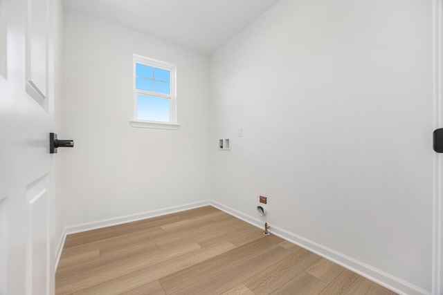 11964 Timber Ct, Bruce, MI 48065 - clothes washing area with laundry area, hookup for a washing machine, gas dryer hookup, baseboards, and light wood-type flooring