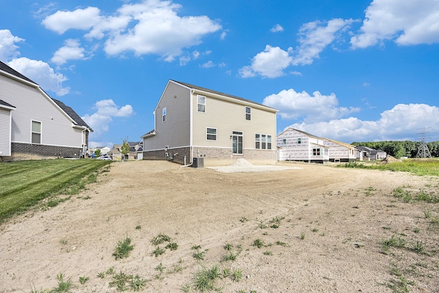 11964 Timber Ct, Bruce, MI 48065 - rear view of property with brick siding and central AC