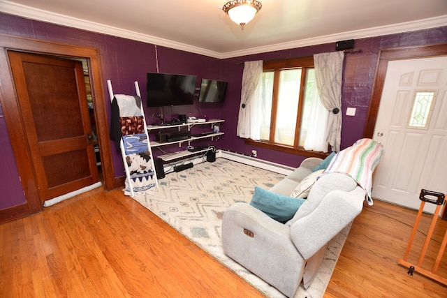 living room with light wood-type flooring, ornamental molding, and a baseboard radiator