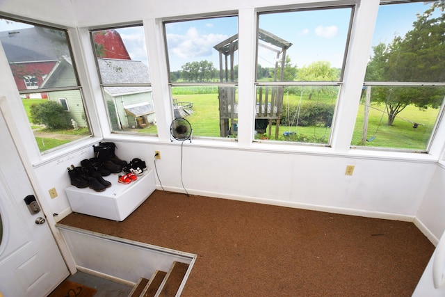 unfurnished sunroom featuring plenty of natural light