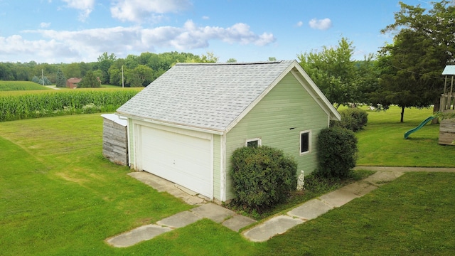 garage featuring a yard