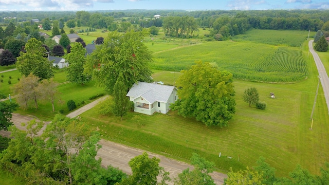 birds eye view of property with a rural view