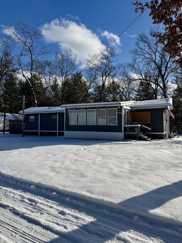 view of snow covered house