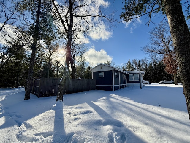 view of yard layered in snow