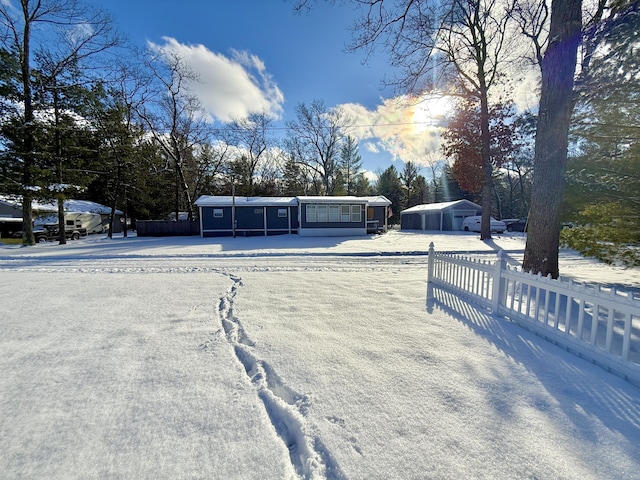 view of yard layered in snow