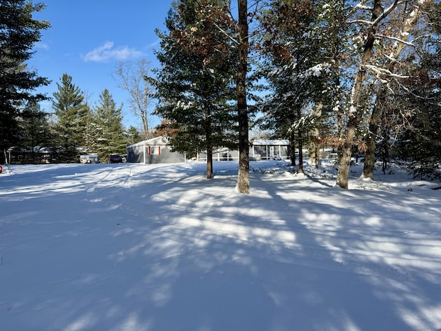 view of yard layered in snow