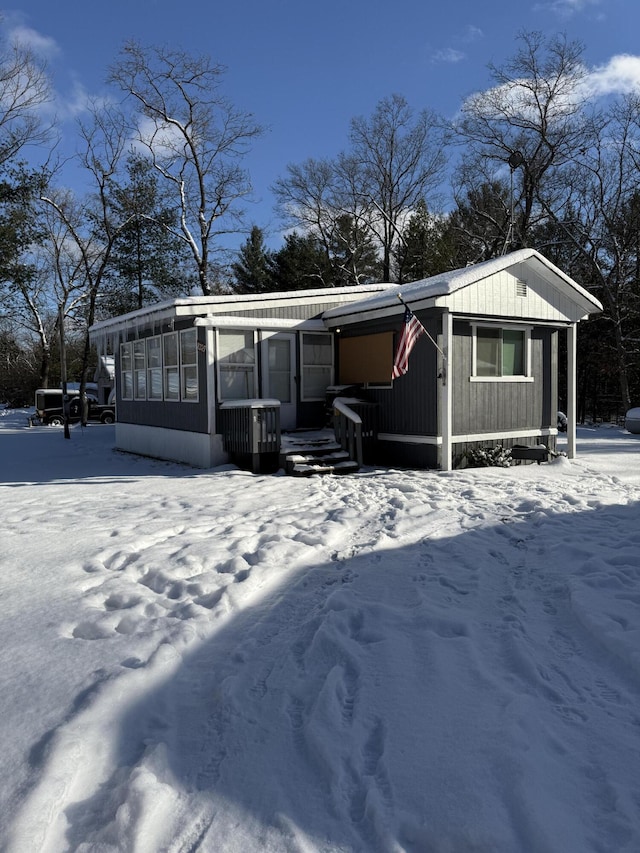 exterior space featuring central AC unit