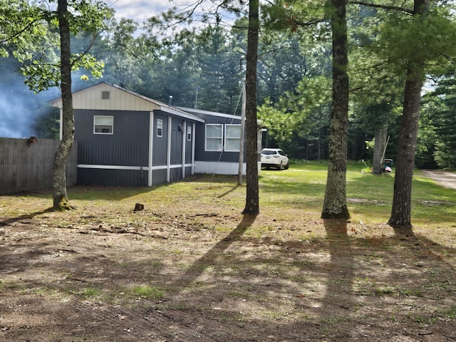 view of property exterior with a yard