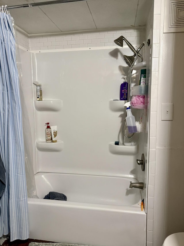 bathroom featuring shower / bath combination with curtain