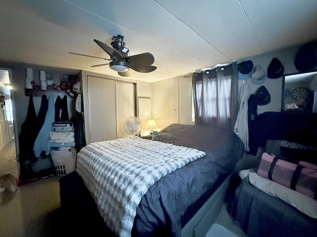 bedroom with ceiling fan and carpet