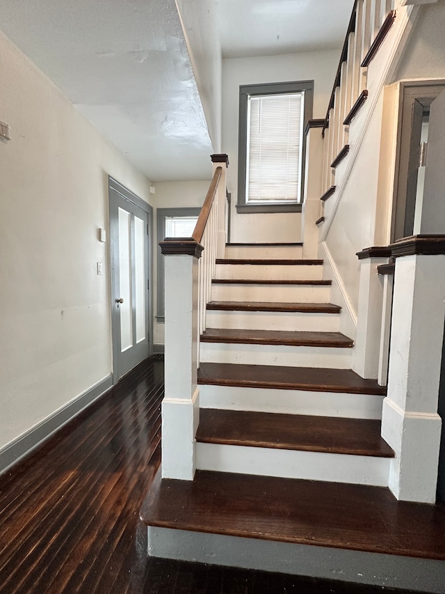 stairs with wood-type flooring