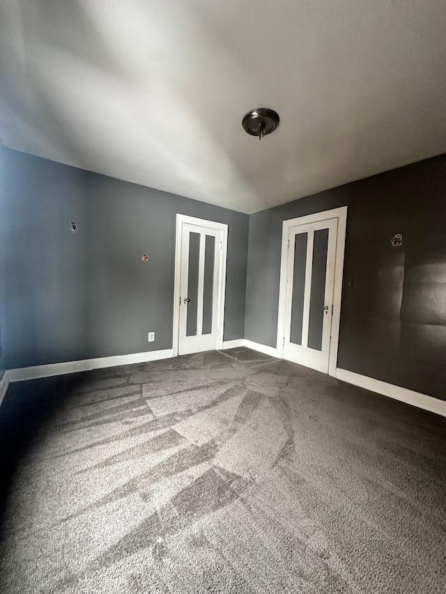 unfurnished room with carpet floors