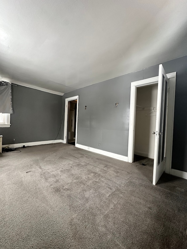 unfurnished room with carpet flooring