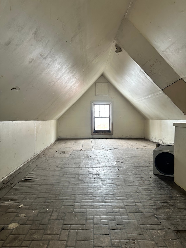 bonus room featuring vaulted ceiling