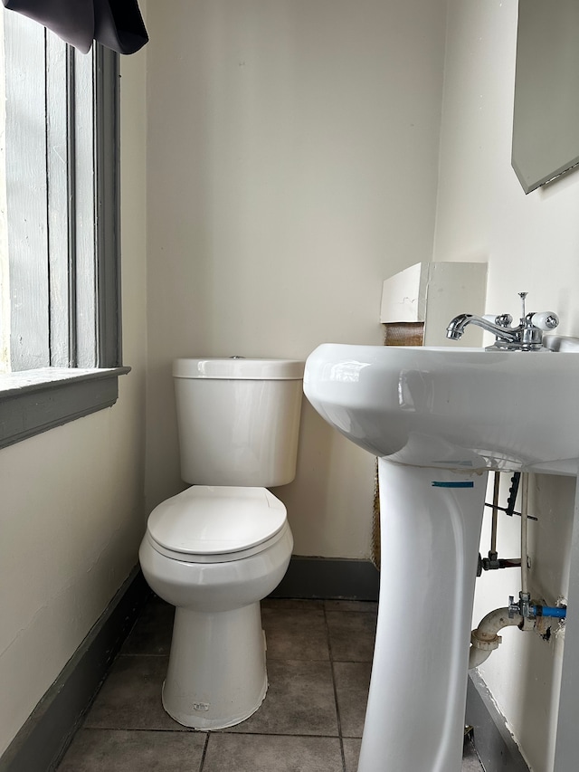 bathroom featuring tile patterned flooring and toilet