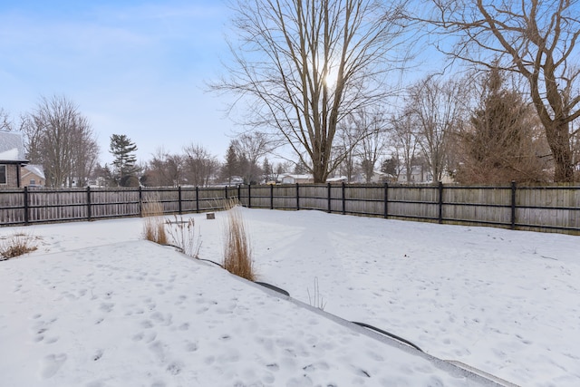 view of yard layered in snow