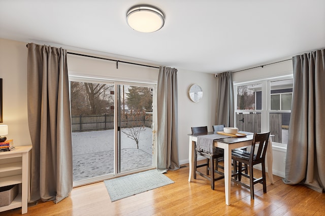 dining area with light hardwood / wood-style flooring