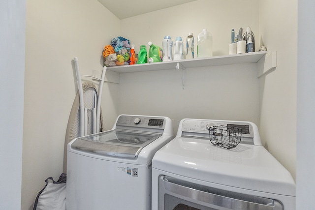 washroom with washer and dryer