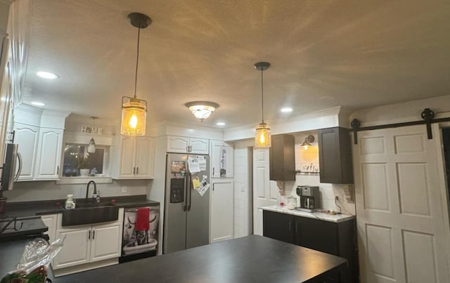 kitchen featuring sink, white cabinets, and stainless steel appliances