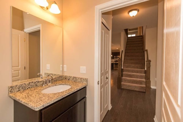 bathroom with wood-type flooring and vanity