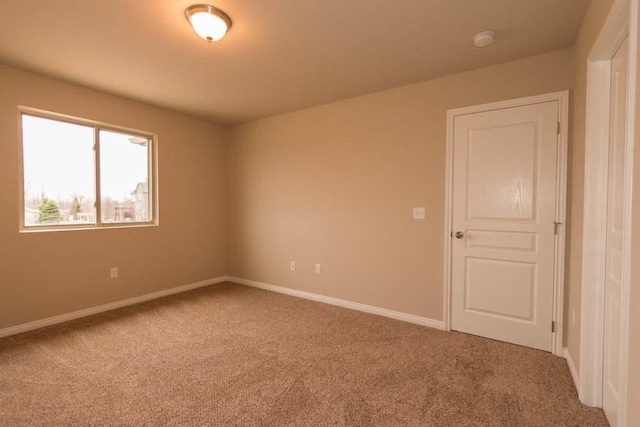 spare room featuring carpet flooring