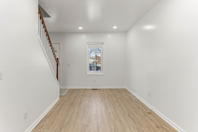 spare room featuring light hardwood / wood-style flooring