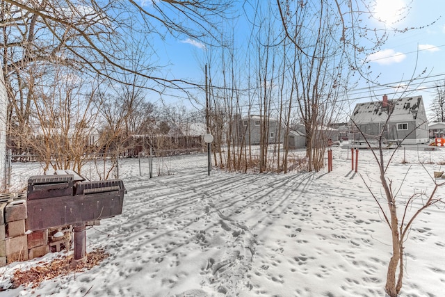 view of yard layered in snow