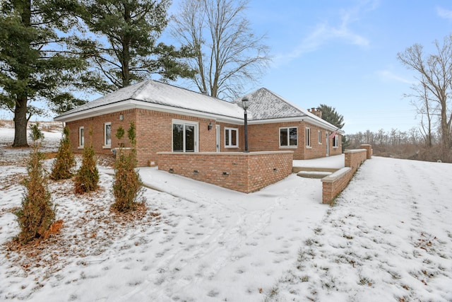 view of snow covered property