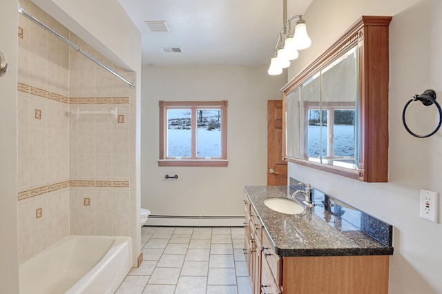 full bathroom with vanity, a healthy amount of sunlight, tile patterned floors, and baseboard heating