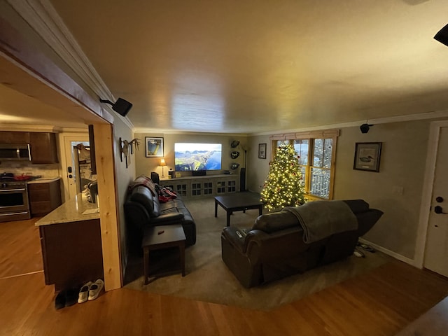 living room with light wood-type flooring and ornamental molding