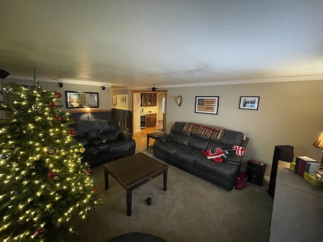 living room featuring ornamental molding and carpet flooring